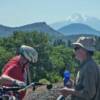 Ken and Jim take a break on the relentless 3% grade. 14,179 foot Mt Shasta is in the background.