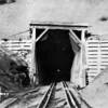 The west portal of the summit tunnel was the scene of the last "Great Train Robbery" on October 11, 1923.  A major fire in the tunnel in 2003 burned the creosote-soaked timbers which collapsed.  The line was reopened in 2005.  For a robbery account:  www.tunnel13.com/history.robbery.html 